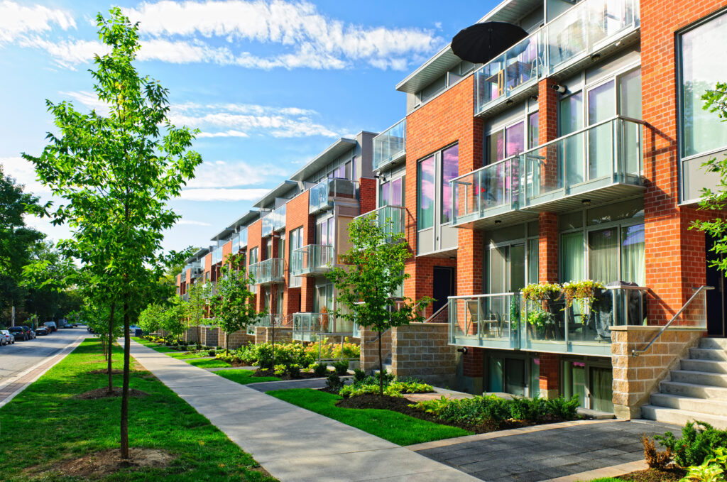 Modern town houses of brick and glass on urban street